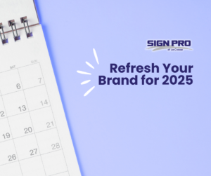 White calendar graphic background with text Refresh your brand for 2025 with Sign Pro!